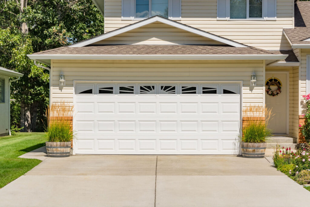 Driveway Landscaping With Planters And Ornamental Grass